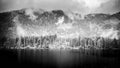 Black and white lake landscape with mountains. Cloudy and foggy view, abstract nature panorama Royalty Free Stock Photo