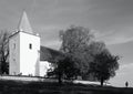 Black and white landscape with church and person