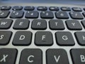 black and white laptop keyboard and alphabet