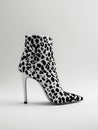 Leopard high heel ankle boot on white background.