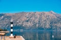 Black and white lighthouse in the sea. Prcanj, Kotor Bay, Monten Royalty Free Stock Photo