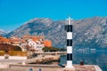 Black and white lighthouse in the sea. Prcanj, Kotor Bay, Monten Royalty Free Stock Photo