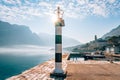 Black and white lighthouse in the sea. Prcanj, Kotor Bay, Monten Royalty Free Stock Photo