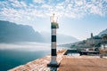 Black and white lighthouse in the sea. Prcanj, Kotor Bay, Monten Royalty Free Stock Photo