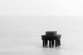 Black and white long exposure photo of a very old architectural structure on sea beach at Digha, West Bengal Royalty Free Stock Photo