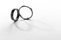 Black and White Love Wedding Rings on white background Royalty Free Stock Photo