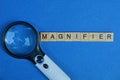 Black white magnifier from the word of wooden letters Royalty Free Stock Photo