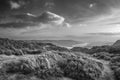 Black and white Majestic Autumn sunset landscape image from Holme Fell looking towards Coniston Water in Lake District Royalty Free Stock Photo