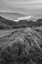 Black and white Majestic Autumn sunset landscape image from Holme Fell looking towards Coniston Water in Lake District Royalty Free Stock Photo