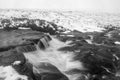 Black and white Majestic Winter landscape image of River Etive in foreground with iconic snowcapped Stob Dearg Buachaille Etive Royalty Free Stock Photo