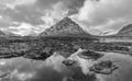 Black and white Majestic Winter landscape image of River Etive in foreground with iconic snowcapped Stob Dearg Buachaille Etive Royalty Free Stock Photo