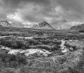 Black and white Majestic Winter landscape image of River Etive in foreground with iconic snowcapped Stob Dearg Buachaille Etive Royalty Free Stock Photo