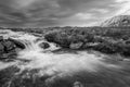 Black and white Majestic Winter landscape image of River Etive in foreground with iconic snowcapped Stob Dearg Buachaille Etive Royalty Free Stock Photo