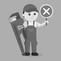 Black and white male plumber holding a cross sign and giant pipe wrench Royalty Free Stock Photo
