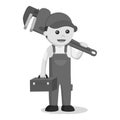 Black and white male plumber holding a giant pipe wrench Royalty Free Stock Photo