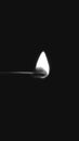 Black and white matchstick flame in a black background, flame stock photos and mobile wallpapers. Royalty Free Stock Photo