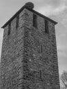 Black and white medieval stone tower with preserved defensive architecture Royalty Free Stock Photo