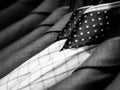 Black and white of men`s shirts and suit hanging on rack.
