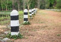 Black and white milestones on a country road Royalty Free Stock Photo