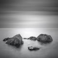 Black & White minimalist seascape with rocks.