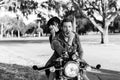 Portrait of Attractive Good Looking Young Modern Trendy Fashionable Guy Girl Couple Riding on Green Motorcycle Cruiser Old School