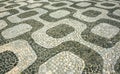 Black and white mosaic, Portuguese pavement by old design pattern at Ipan