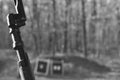 Black and White Mosin Nagant Wood Gun Rifle Stock with Bayonet Attached and Targets in the Background Royalty Free Stock Photo