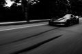 Black and White motion Blur Roller of American Muscle Car driving Fast