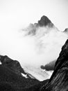 Black and white Mountains in cloud above a glacier