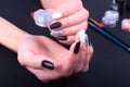 Black, white Nail art manicure. Holiday style bright Manicure with sparkles. Beauty hands. Stylish Nails, Nail Polish Royalty Free Stock Photo