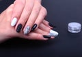 Black, white Nail art manicure. Holiday style bright Manicure with sparkles. Beauty hands. Stylish Nails, Nail Polish Royalty Free Stock Photo