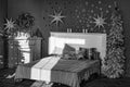 Black and white, New Year`s interior. Bedroom with fireplace decorated with Christmas stars. Royalty Free Stock Photo