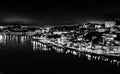 Black and white night cityscape panorama of Porto old town and river Douro banks skyline with water reflections in Porto, Portugal Royalty Free Stock Photo