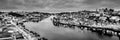 Black and white night cityscape panorama skyline of Porto old town, Luis I Bridge and river Douro banks with reflections Royalty Free Stock Photo