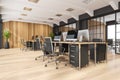 Black-and-white office space with sliding doors and wooden materials. Corner view Royalty Free Stock Photo