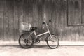 Black and white old bicycle leaning against wall Royalty Free Stock Photo