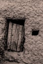 Black and white old door with a mud wall Royalty Free Stock Photo