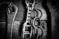 Black and white of old farm tools on wall