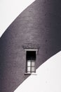 Black white painted brick wall lighthouse window Royalty Free Stock Photo