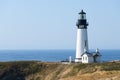 Black and white painted Yaquina lighthouse at the Outstanding Natural Area