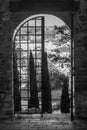 Black and white view of the historic center of Fucecchio, Florence, Italy, framed by one of the ancient doors to the Corsini Park