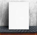Black White paper poster lean at concrete wall and fabric table,Template mock up for adding your text