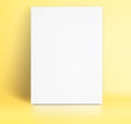 Black White paper poster lean at pastel yellow studio room,Template mock up for adding your text Royalty Free Stock Photo