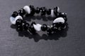 Black and white pearl bracelet on black Royalty Free Stock Photo