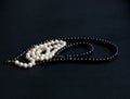 Black and white pearls black background Royalty Free Stock Photo