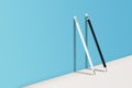 Black and White pencils standing on white floor and shadow on blue wall. Royalty Free Stock Photo