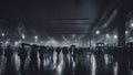 black and white people subway crowded train station that is filled with people and trains in a rainy night. The station is gray