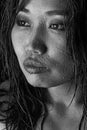 Black and white photo of Asian model with wet hair and drops of water on face