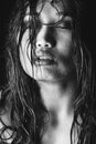 Black and white photo of Asian model with wet hair and drops of water on face Royalty Free Stock Photo