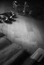 Black and white photo of bakery equipment place on wood table.